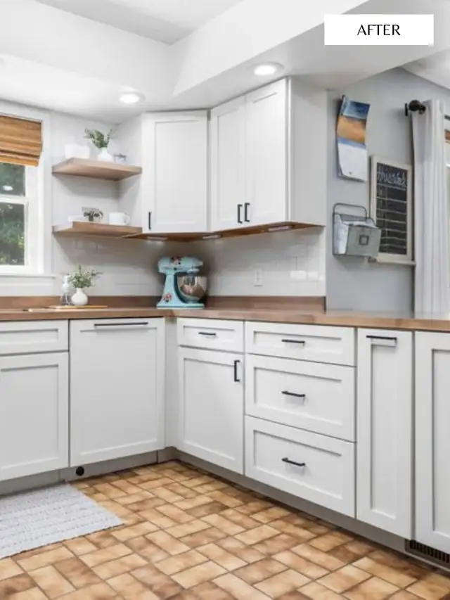 White shaker kitchen with butcher-block counters, floating wood shelves and light blue walls