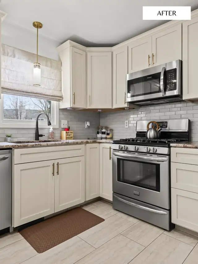 Kitchen with cream shaker cabinets, a gray subway tile backsplash, a stainless gas range and a brass pendant over the sink